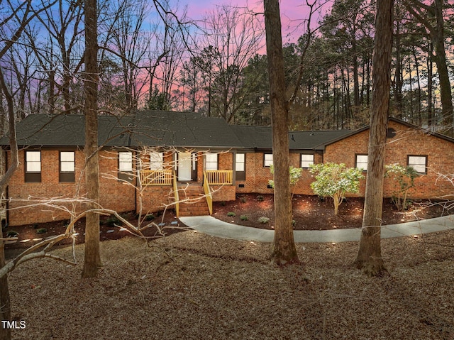 view of front of home featuring brick siding