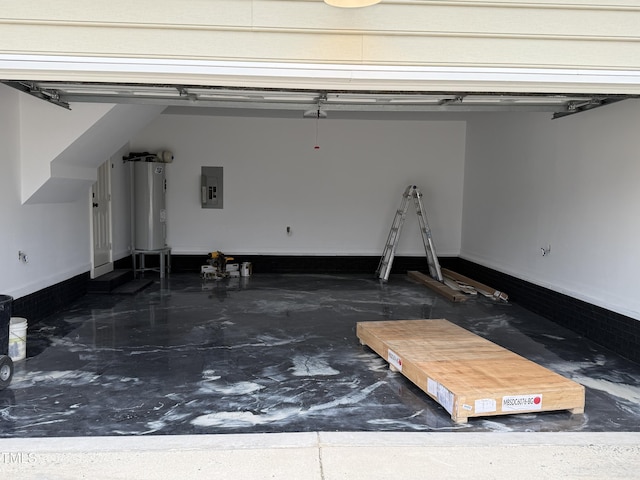 garage featuring electric panel, baseboards, and water heater