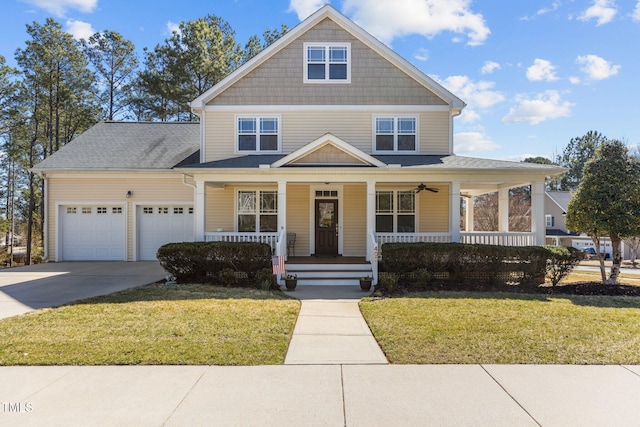 view of front of property with a front lawn, a porch, concrete driveway, and an attached garage