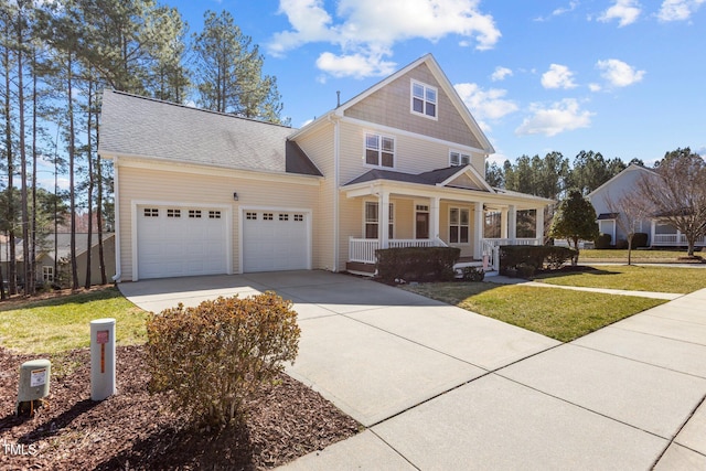 view of front facade featuring a garage, a porch, concrete driveway, and a front lawn