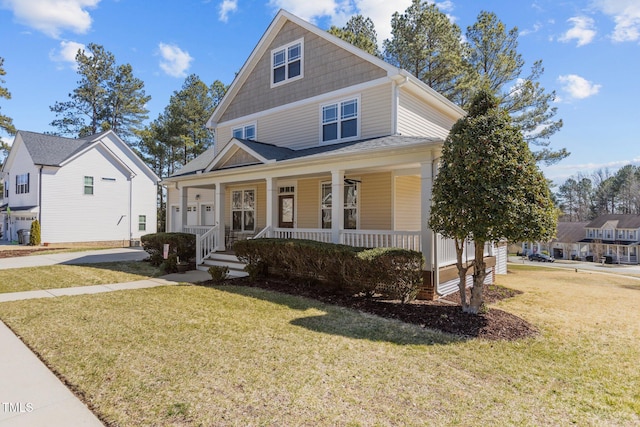 view of front of property with a porch and a front yard