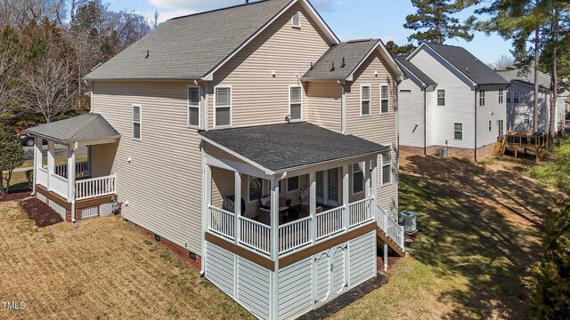 back of house featuring a porch, roof with shingles, central AC unit, a yard, and crawl space