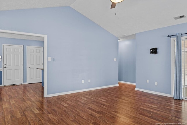 spare room with visible vents, a ceiling fan, wood finished floors, baseboards, and lofted ceiling