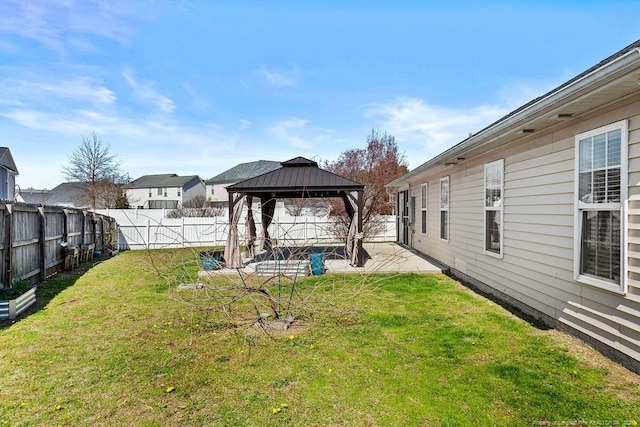 view of yard with a gazebo, a fenced backyard, and a patio area