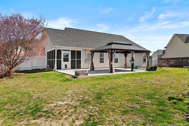 back of house with a gazebo, a lawn, a patio, and fence