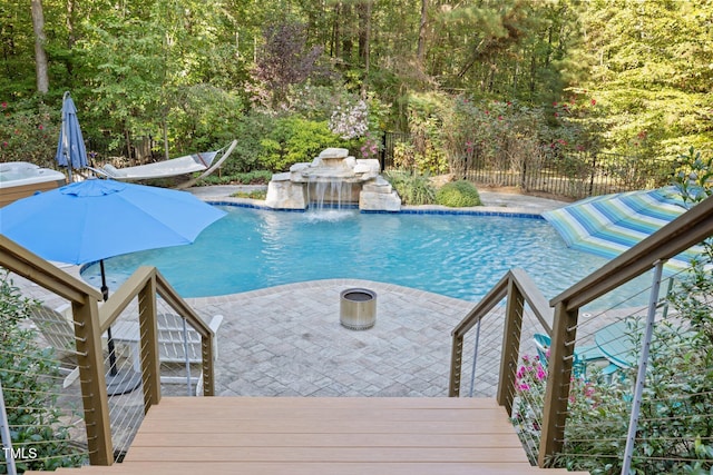 view of pool featuring a fenced in pool, a deck, and fence