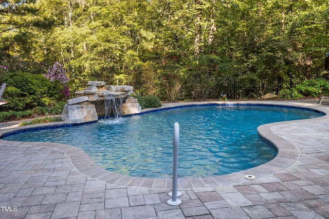 view of swimming pool featuring a patio area and a fenced in pool