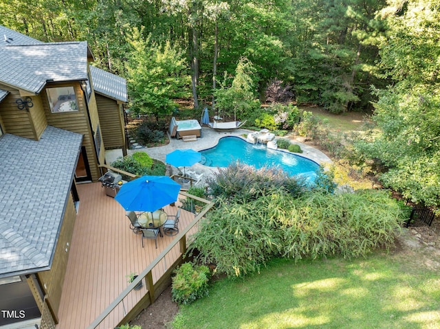 pool featuring a grill, a yard, and a wooden deck