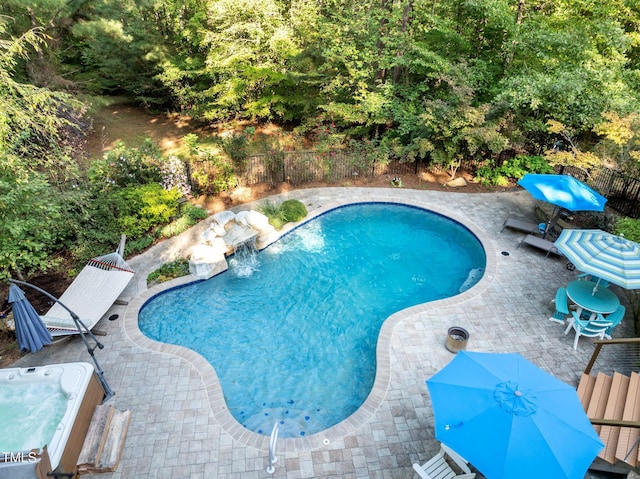 view of pool featuring a patio area, fence, and a fenced in pool