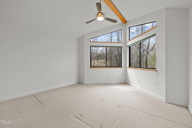 unfurnished room featuring beamed ceiling, baseboards, ceiling fan, and carpet flooring