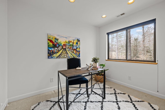 carpeted office space featuring recessed lighting, visible vents, and baseboards