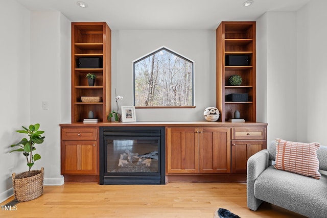 interior space with light wood-style flooring, recessed lighting, and baseboards