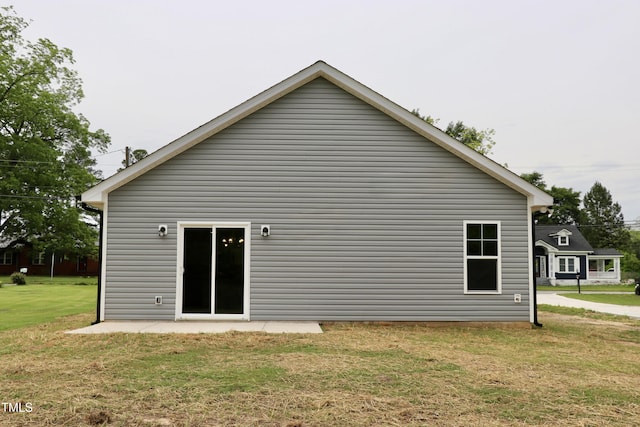 306 E Roseboro St, Roseboro, NC 28382 - back of property with a yard and a patio area