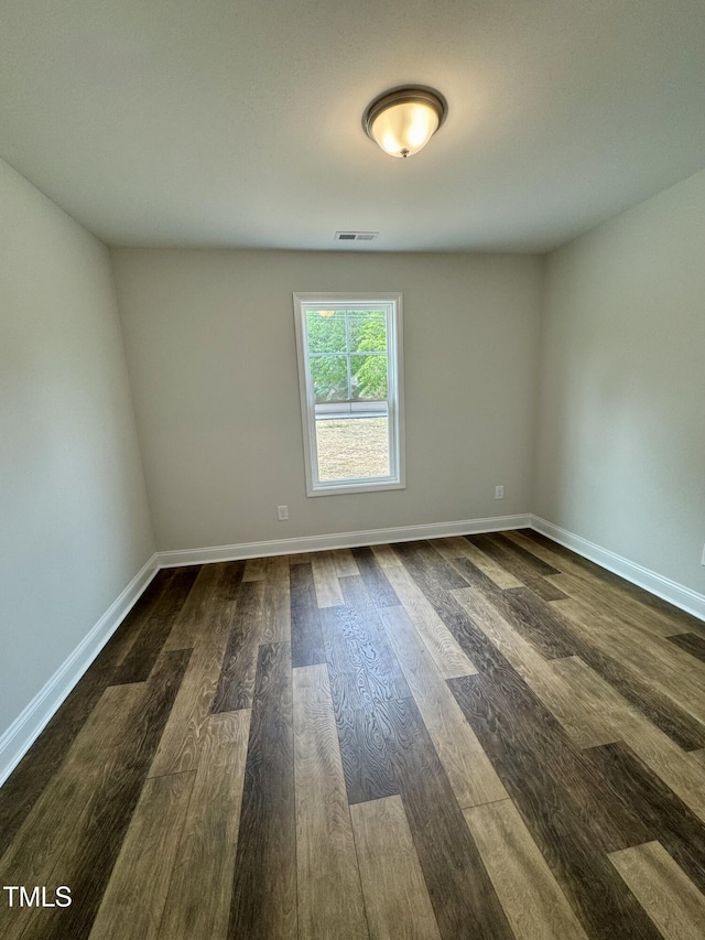 306 E Roseboro St, Roseboro, NC 28382 - unfurnished room featuring dark wood-style floors and baseboards