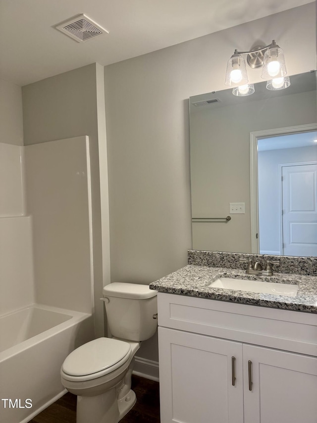 306 E Roseboro St, Roseboro, NC 28382 - bathroom with vanity, toilet, wood finished floors, and  shower combination