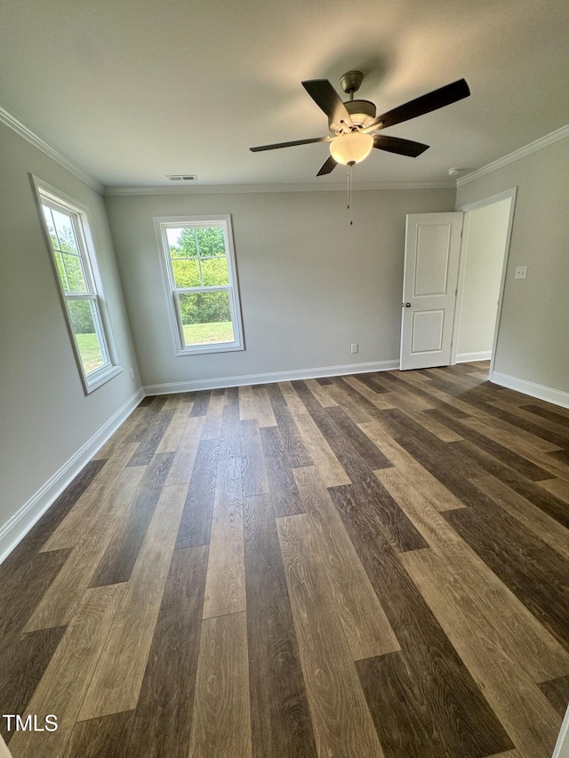 306 E Roseboro St, Roseboro, NC 28382 - unfurnished room with dark wood-style floors, crown molding, a ceiling fan, and baseboards