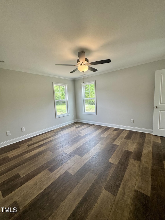 306 E Roseboro St, Roseboro, NC 28382 - spare room featuring dark wood finished floors, a ceiling fan, baseboards, and crown molding