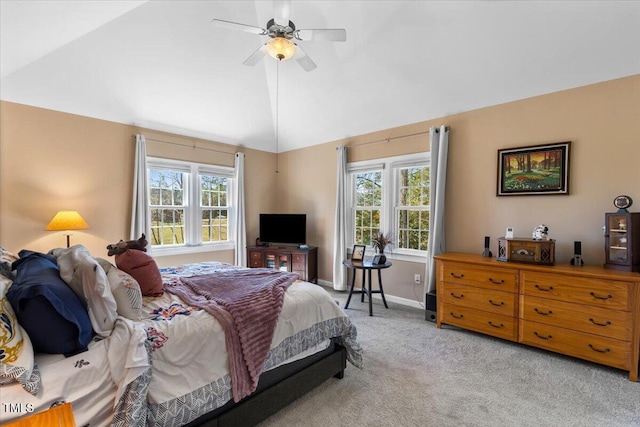 bedroom featuring light colored carpet, baseboards, lofted ceiling, and multiple windows