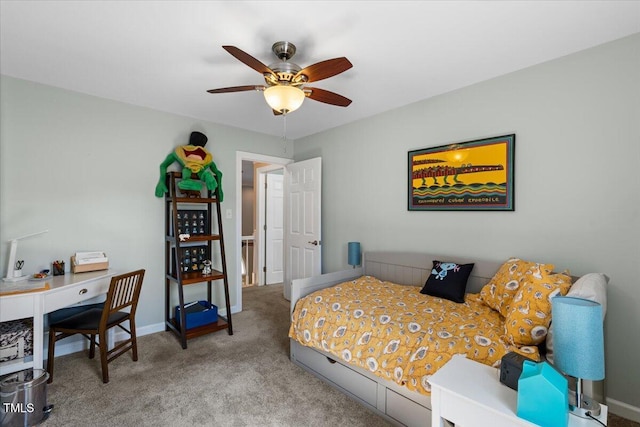 bedroom with ceiling fan, baseboards, and carpet floors