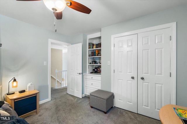 bedroom featuring a closet, carpet floors, baseboards, and a ceiling fan