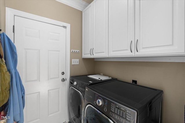 laundry room featuring washer and dryer and cabinet space