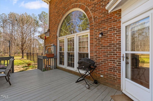 wooden terrace with area for grilling