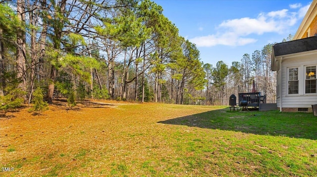 view of yard with a wooden deck