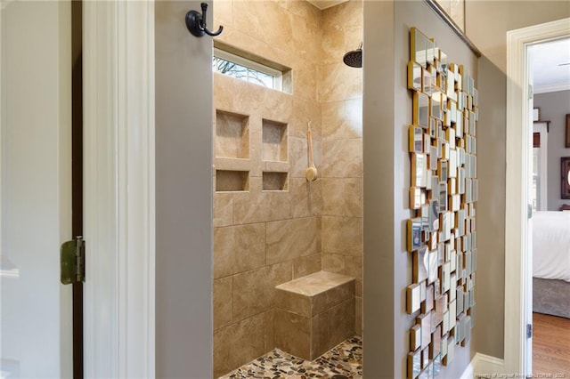 ensuite bathroom with tiled shower and ensuite bathroom