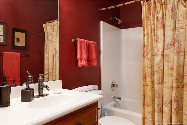 full bathroom with vanity, shower / tub combo, and toilet