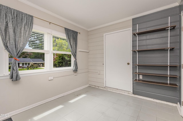 unfurnished bedroom featuring baseboards and ornamental molding