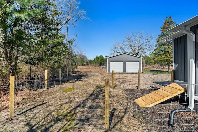 view of yard with an outbuilding and a garage