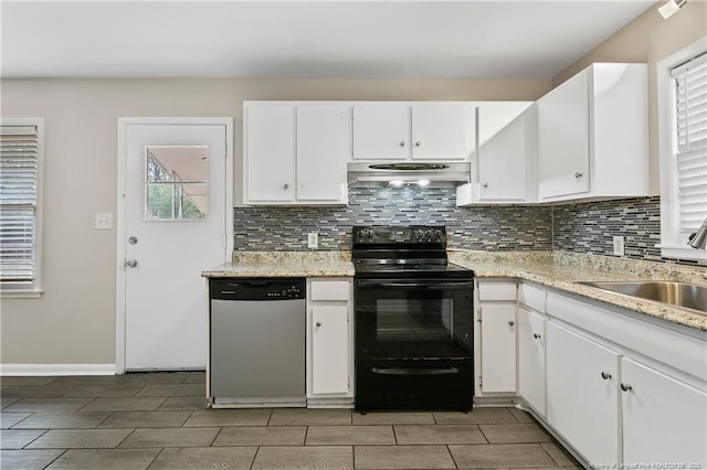 kitchen featuring under cabinet range hood, a sink, stainless steel dishwasher, tasteful backsplash, and black / electric stove