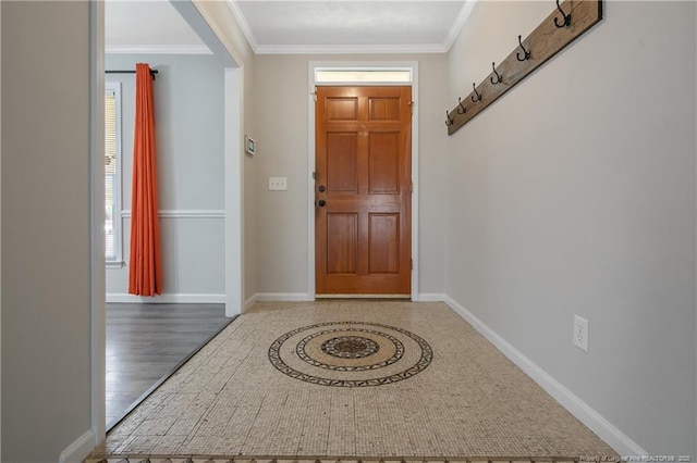 entryway featuring baseboards and ornamental molding