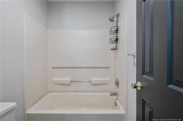 bathroom featuring toilet and shower / bathtub combination