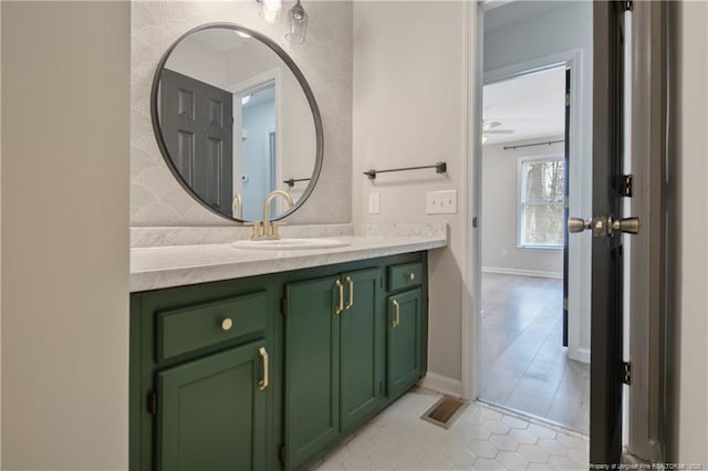 bathroom featuring vanity and baseboards