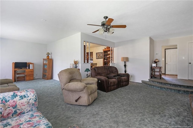 carpeted living room with ceiling fan