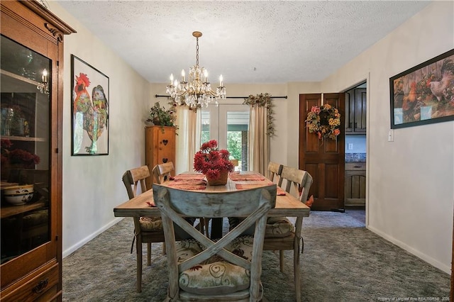 dining space with a textured ceiling, an inviting chandelier, and dark colored carpet