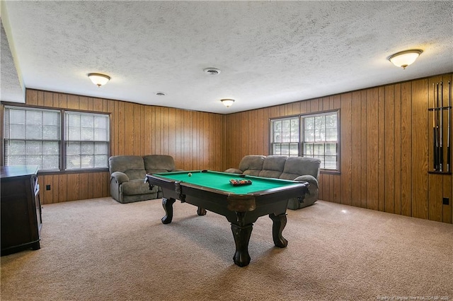 game room featuring carpet flooring, wood walls, a textured ceiling, and billiards