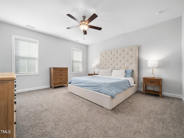 bedroom with visible vents, a ceiling fan, baseboards, and carpet floors