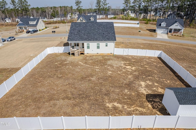 birds eye view of property with a residential view