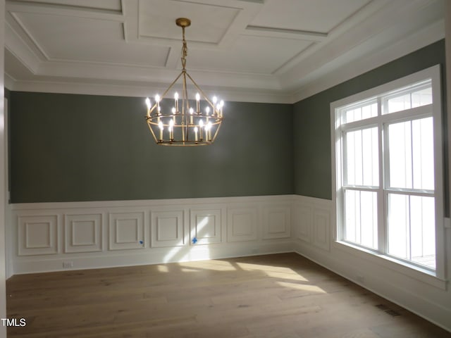 unfurnished dining area featuring a chandelier, visible vents, a healthy amount of sunlight, and light wood-style flooring