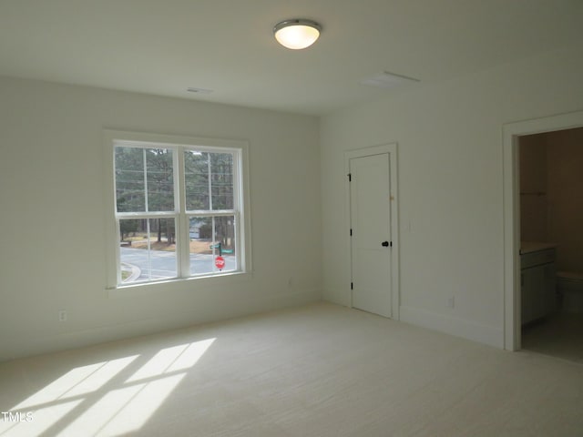 unfurnished bedroom featuring baseboards and carpet floors