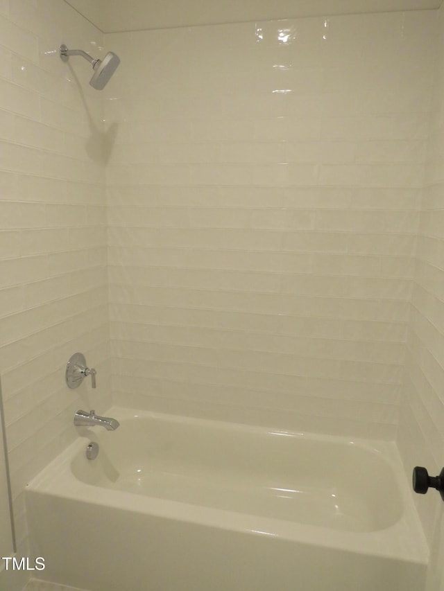 bathroom with washtub / shower combination