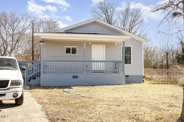 view of front of house featuring covered porch and crawl space