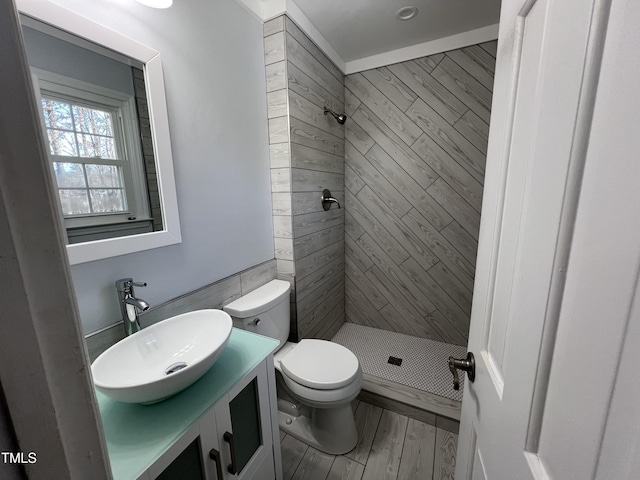 full bath with vanity, toilet, wood finished floors, and a shower stall