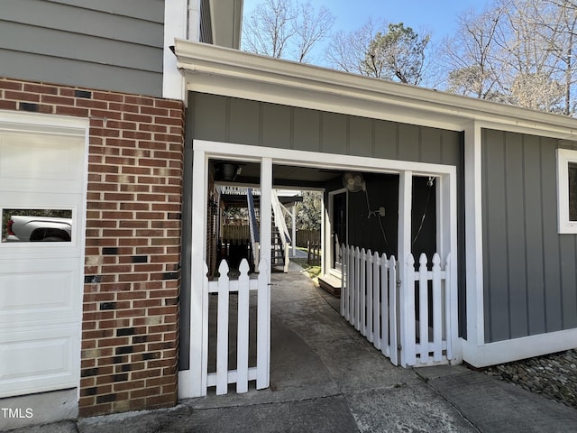 view of exterior entry with brick siding