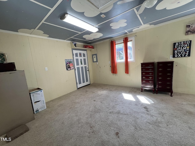 below grade area with carpet and refrigerator