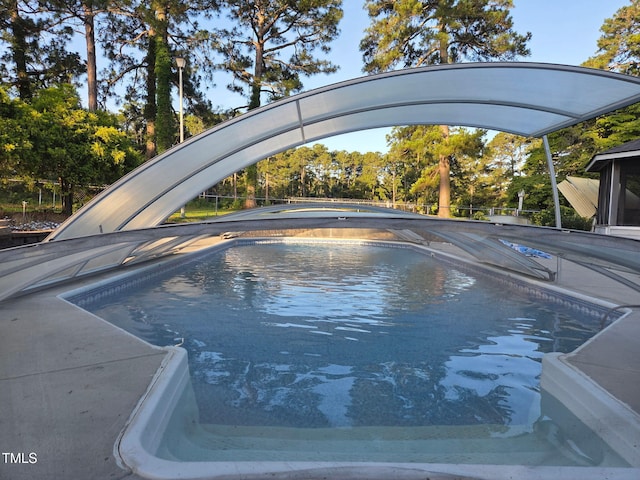5350 Clubhouse Ln, Hope Mills, NC 28348 - swimming pool featuring view of wooded area