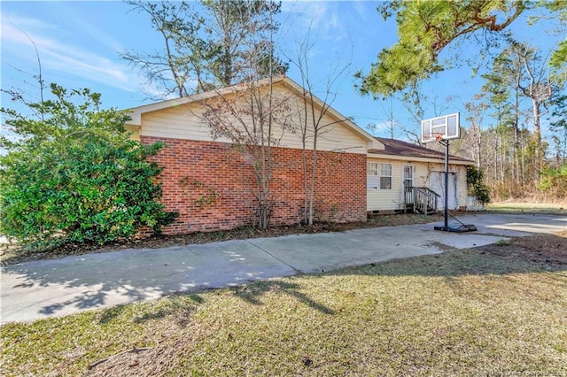 view of home's exterior with a yard