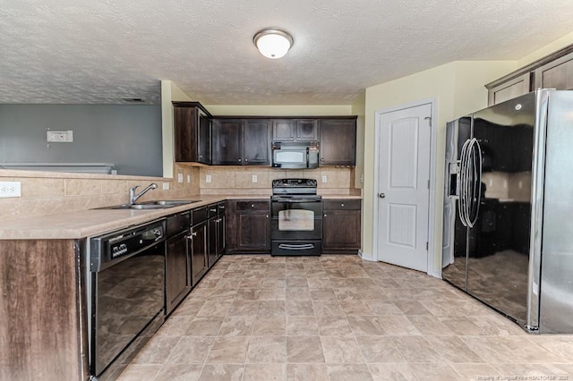 kitchen with tasteful backsplash, dark brown cabinets, light countertops, black appliances, and a sink